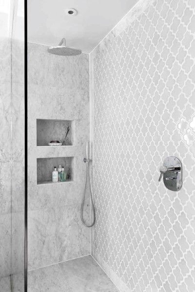 gray tile small shower with recessed shelves 