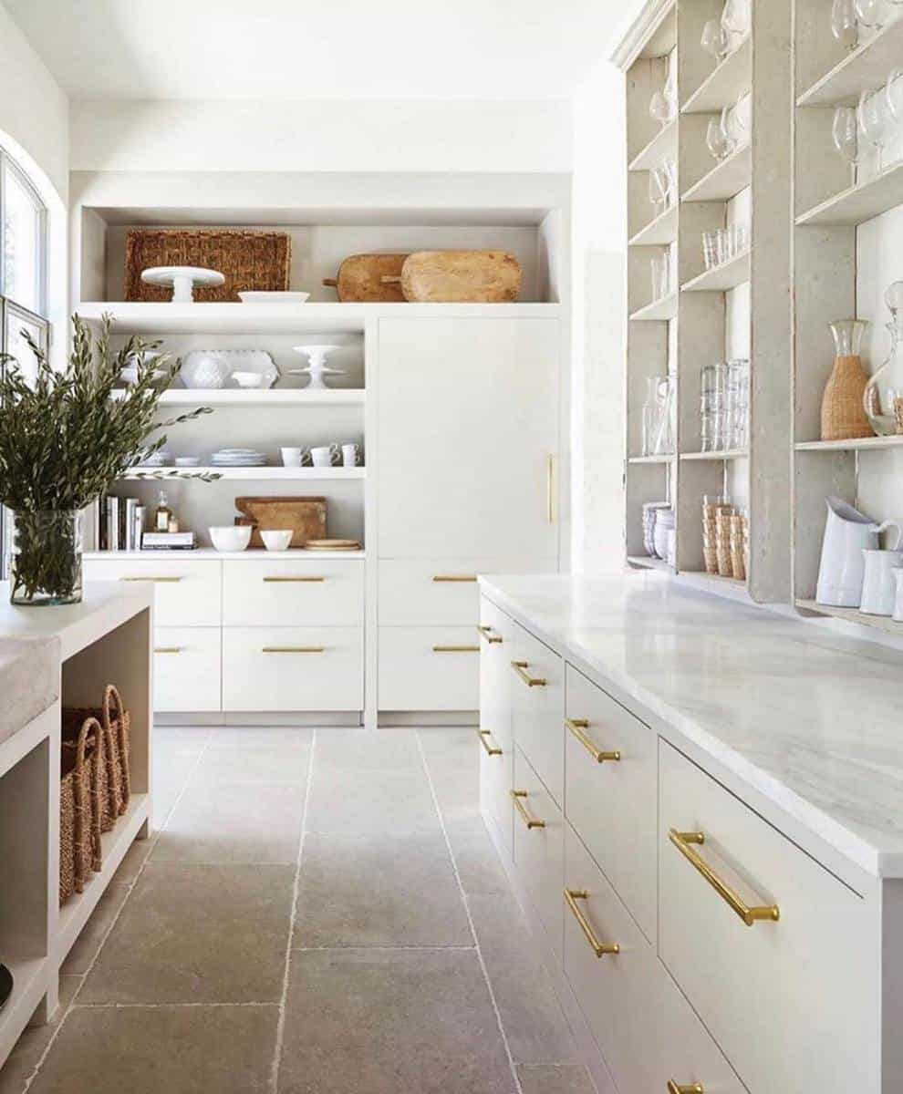 large white kitchen marble countertops gold accents tile floor
