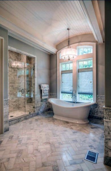 luxury master bathroom with white tub
