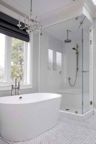 minimalist bathroom freestanding bathtub white tile floor chandelier