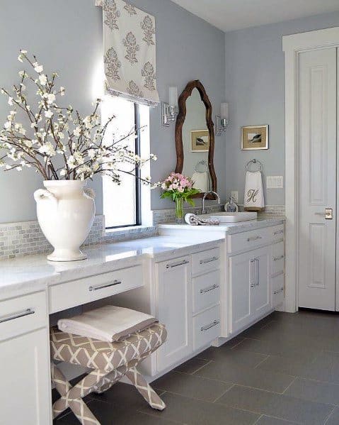 traditional white bathroom vanity with marble countertop