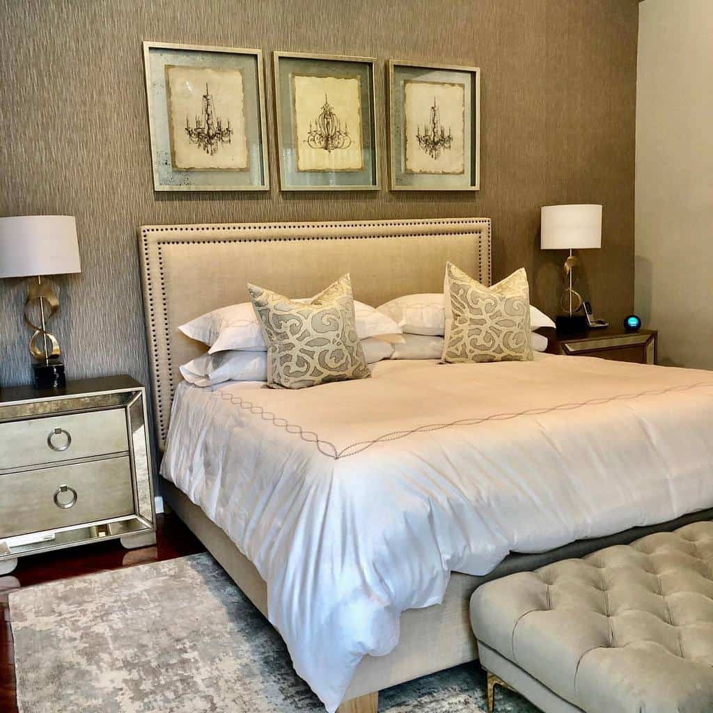 elegant bedroom gray walls framed art silver bedside tables 