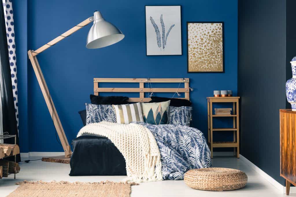 two tone blue bedroom wood bed large lamp