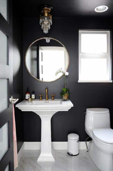 black and white powder room with marble floor