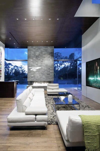 minimalist cozy living room white sofa stone fireplace wall mounted tv