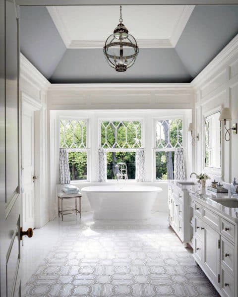 vaulted ceiling above white tub master bathroom