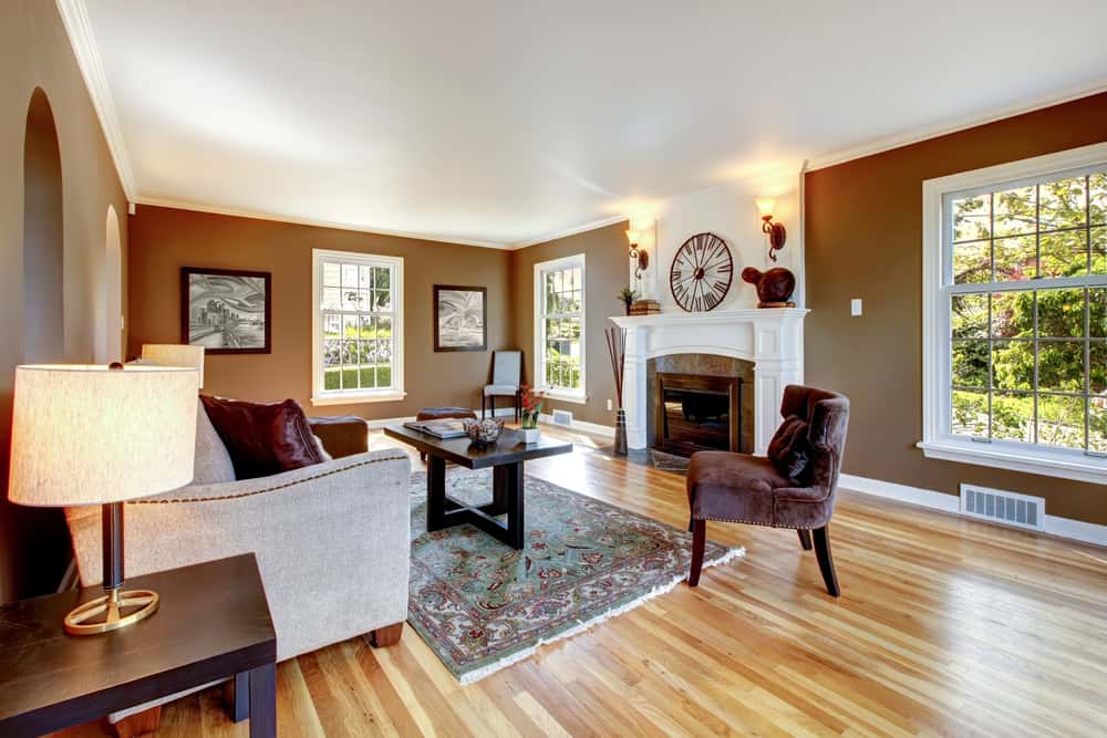 large cottage living room brown walls vinyl flooring 