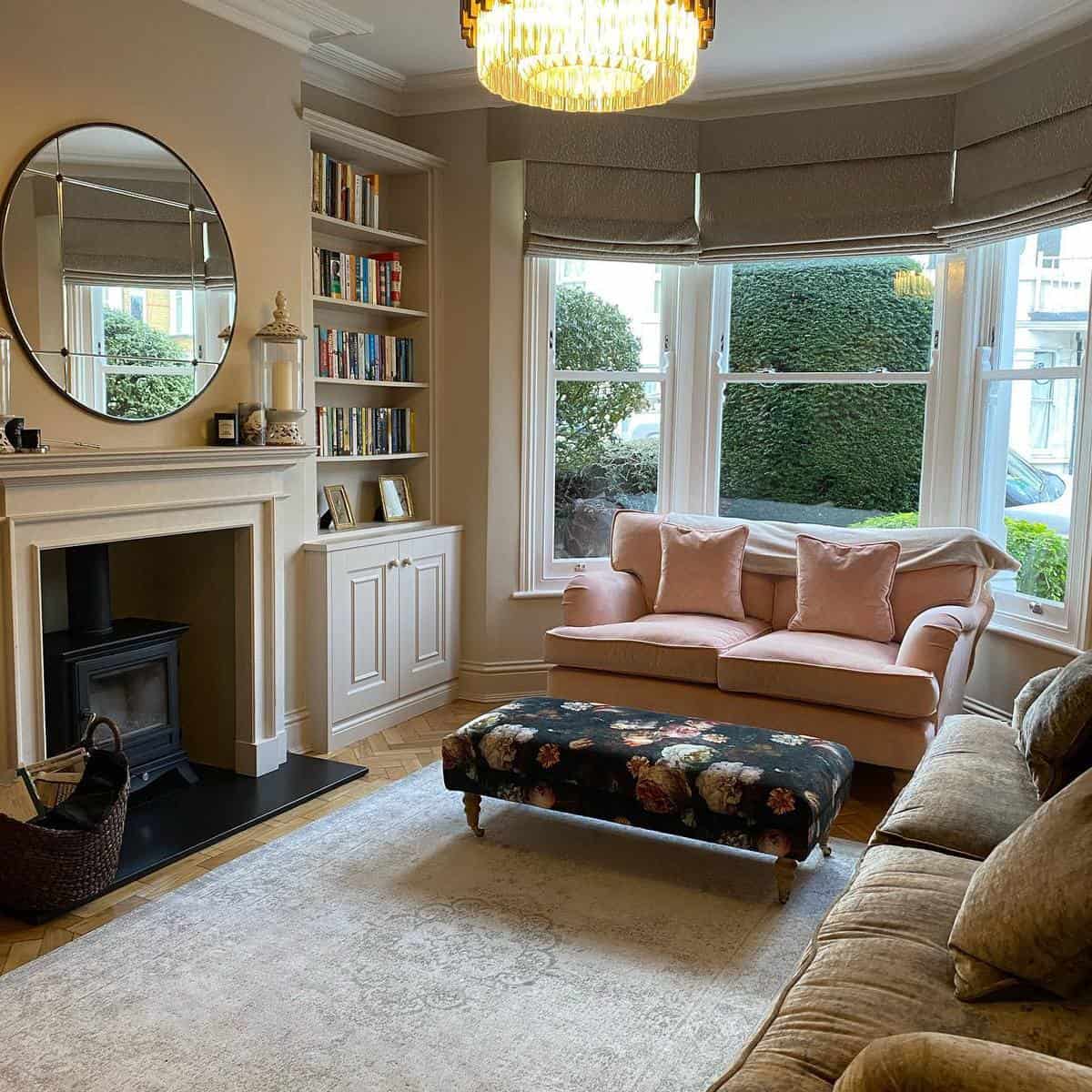 elegant living room pink sofa fireplace bookshelf 
