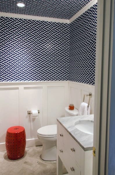two tone white wall blue and white deign wallpaper bathroom red basket 