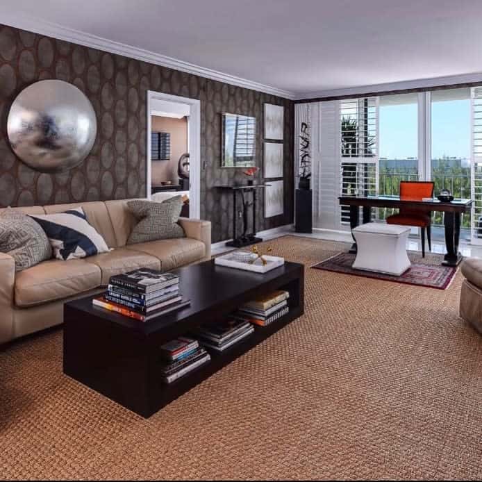 modern living room brown wallpaper carpet desk couch