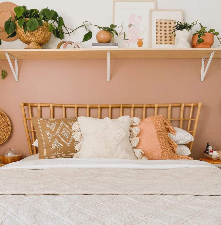 warm color boho bedroom above bed shelf
