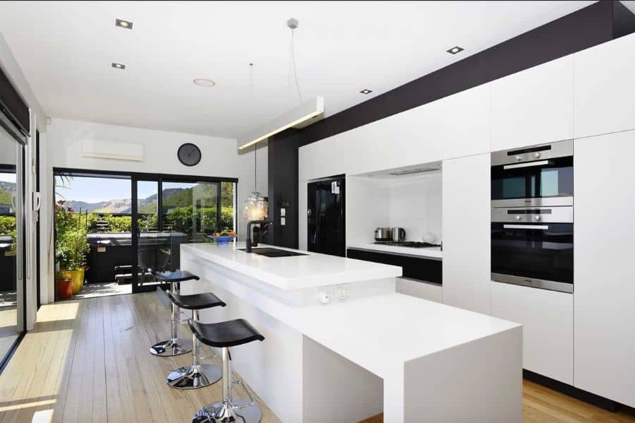 long white kitchen bar in modern kitchen 