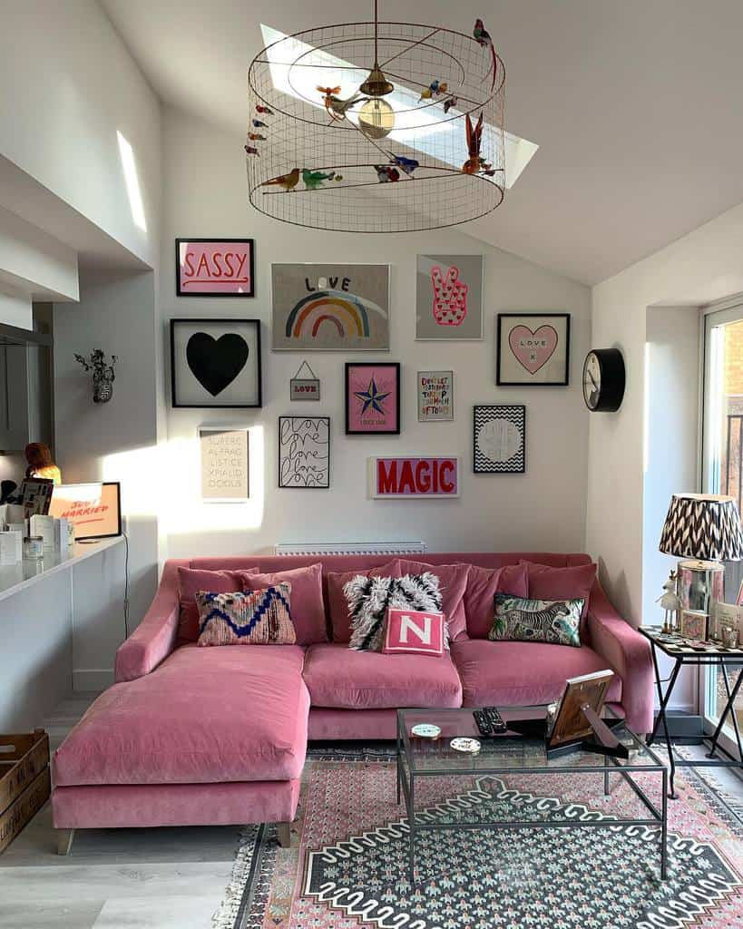 white living room pink sofa glass table wall art 