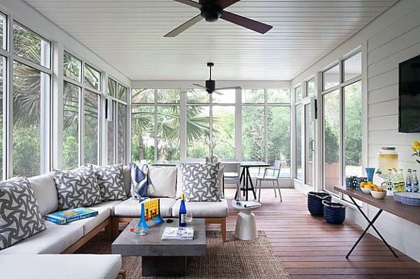 large modern sun room white couch ceiling fan