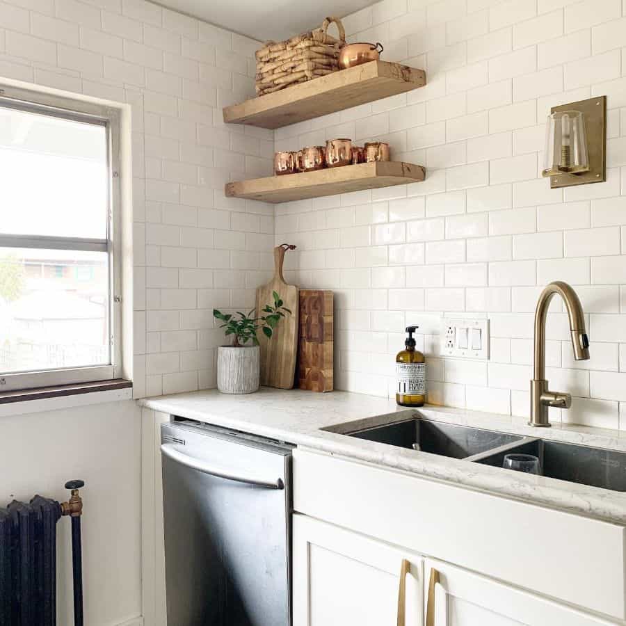 white tile kitchen wood floating wall shelves sconces lighting 