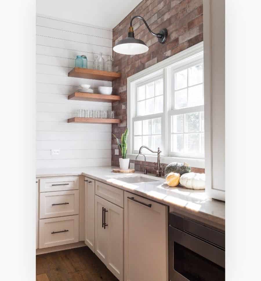 country kitchen white wood shiplap wall floating wood shelves 