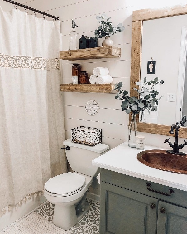 white shiplap wall in farmhouse bathroom with wood accents 