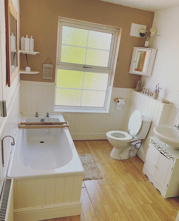 small farmhouse bathroom white tub