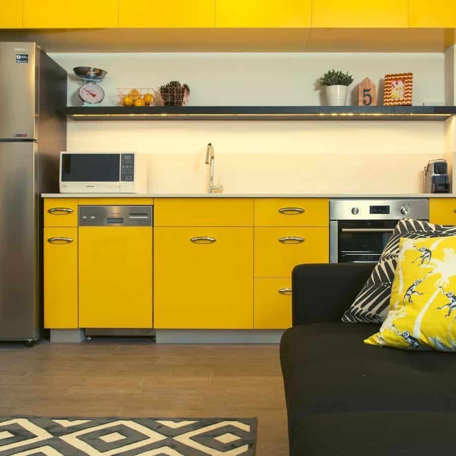 modern yellow kitchen black sofa 