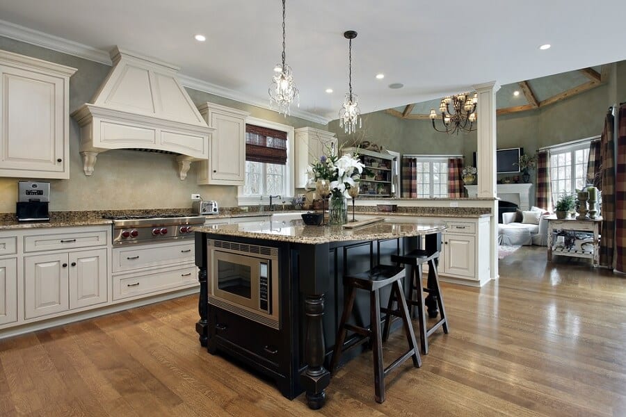 large rustic kitchen white wooden cabinets black island with granite countertop 